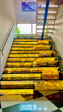 Elegant marble staircase with backlit onyx effect